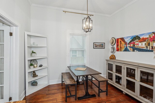 dining space with an inviting chandelier, dark wood-type flooring, and crown molding