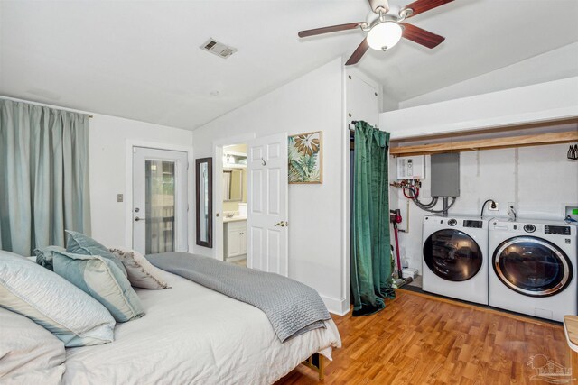 bedroom featuring lofted ceiling, independent washer and dryer, ceiling fan, light hardwood / wood-style floors, and ensuite bathroom