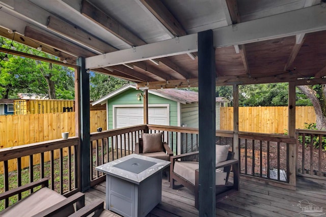 wooden terrace with an outbuilding