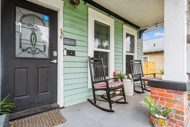 doorway to property featuring covered porch