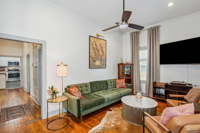 living room featuring crown molding, ceiling fan, and hardwood / wood-style flooring