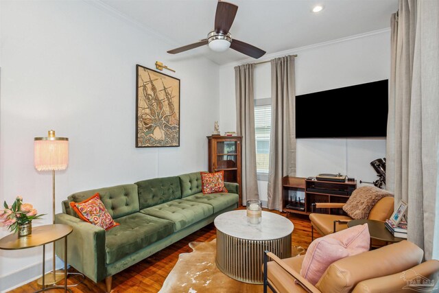 living room featuring ornamental molding, ceiling fan, and hardwood / wood-style floors