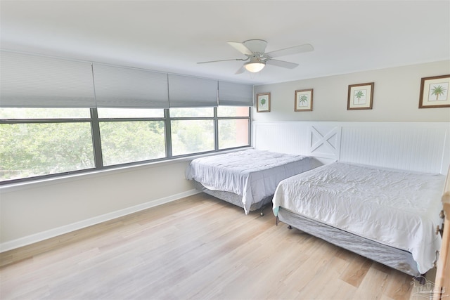 bedroom featuring light hardwood / wood-style floors and ceiling fan