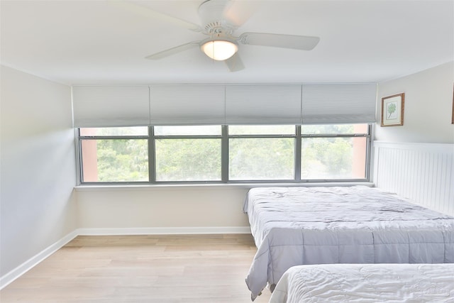 bedroom with light wood-type flooring and ceiling fan