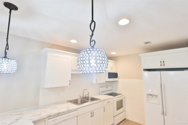 kitchen with white appliances, white cabinetry, sink, and decorative light fixtures