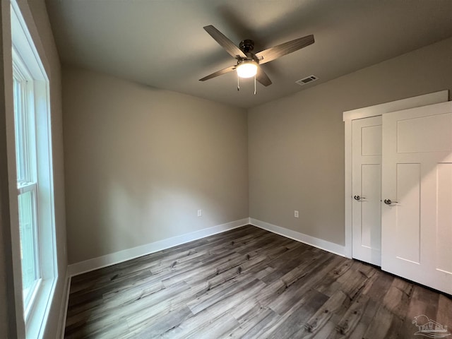 empty room featuring ceiling fan and hardwood / wood-style flooring