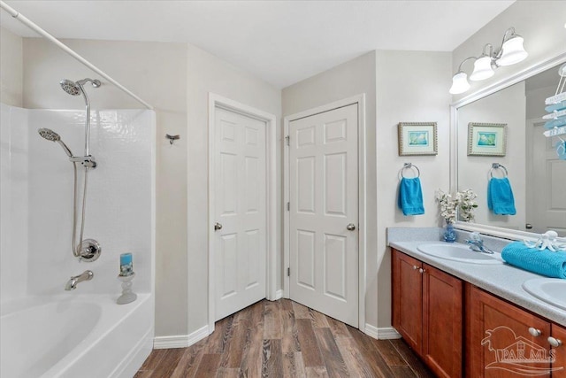 bathroom featuring vanity,  shower combination, and hardwood / wood-style flooring