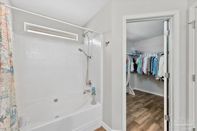 bathroom with wood-type flooring and shower / bathtub combination with curtain