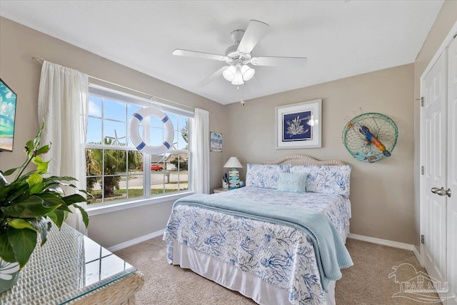 bedroom featuring carpet floors, a closet, and ceiling fan