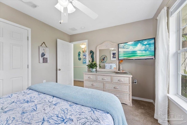 bedroom with ceiling fan and carpet floors