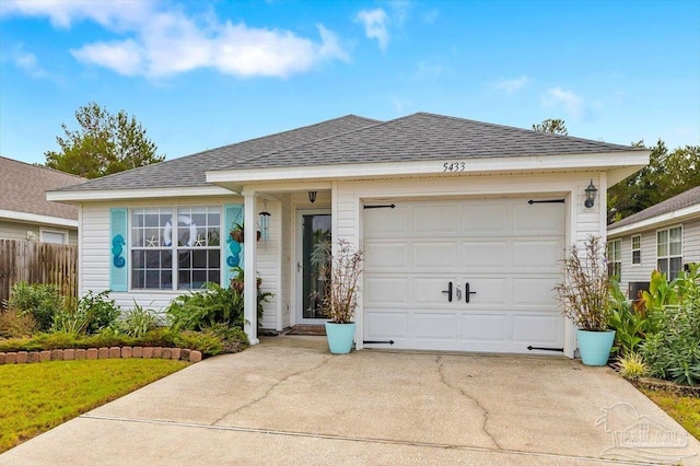 ranch-style house featuring a garage