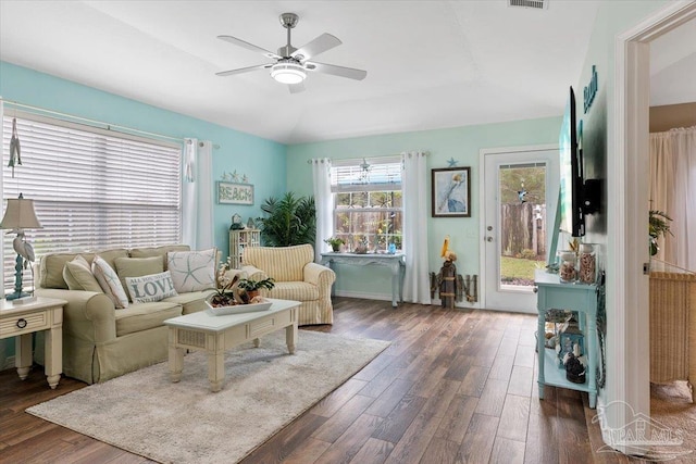 living room featuring lofted ceiling, ceiling fan, and dark hardwood / wood-style floors