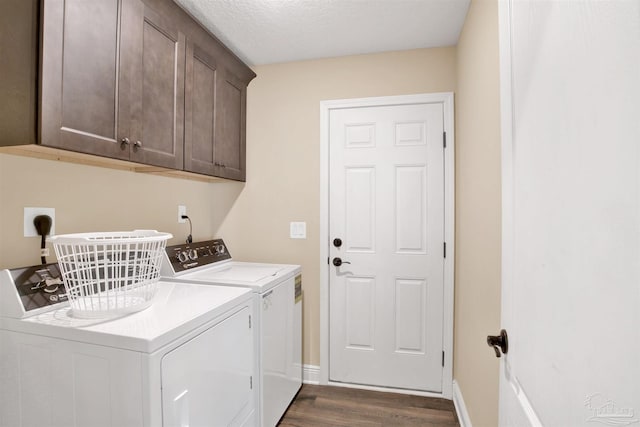 2956 N 17th Ave, Milton, FL 32583 - laundry area with washing machine and clothes dryer, cabinet space, dark wood-style floors, and baseboards