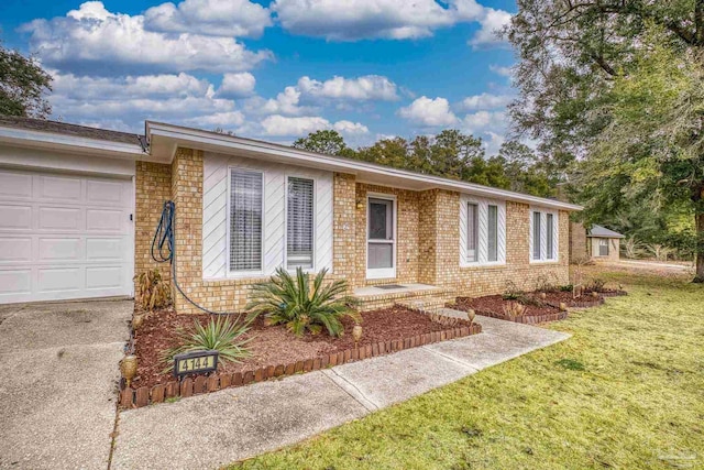 ranch-style home with a garage and a front yard