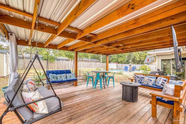 wooden terrace with outdoor lounge area