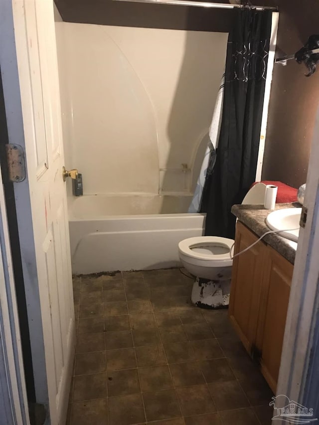full bath with vanity, tile patterned flooring, toilet, and shower / tub combo