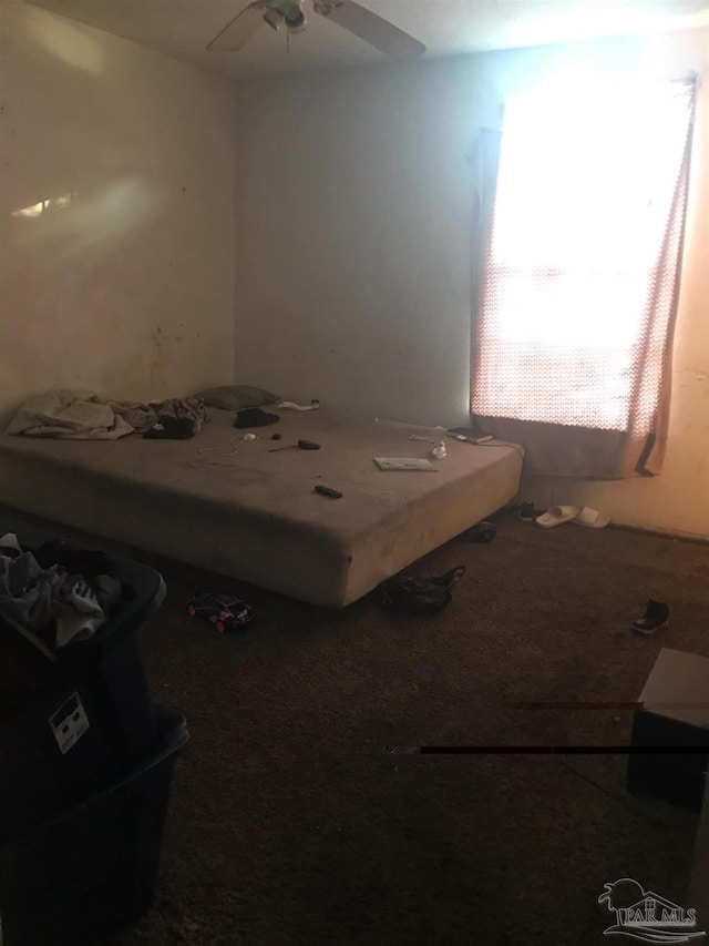 carpeted bedroom featuring a ceiling fan