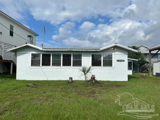 exterior space with a lawn