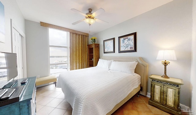 931 W Beach Blvd Unit 501, Gulf Shores, AL 36542 - bedroom featuring light tile patterned floors and a ceiling fan