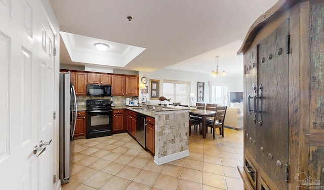 931 W Beach Blvd Unit 501, Gulf Shores, AL 36542 - kitchen featuring black appliances, a sink, a peninsula, a chandelier, and crown molding