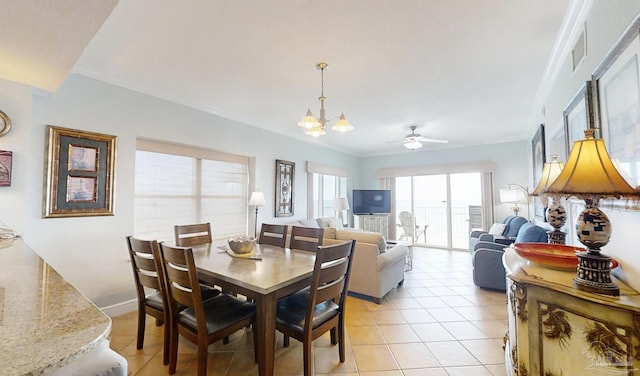 931 W Beach Blvd Unit 501, Gulf Shores, AL 36542 - dining space with a chandelier, light tile patterned flooring, ornamental molding, a ceiling fan, and baseboards