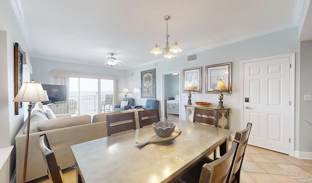 931 W Beach Blvd Unit 501, Gulf Shores, AL 36542 - dining space with a ceiling fan, light tile patterned flooring, crown molding, and a chandelier