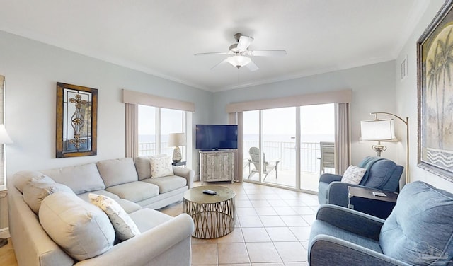 931 W Beach Blvd Unit 501, Gulf Shores, AL 36542 - living area featuring a ceiling fan, healthy amount of natural light, light tile patterned floors, and ornamental molding