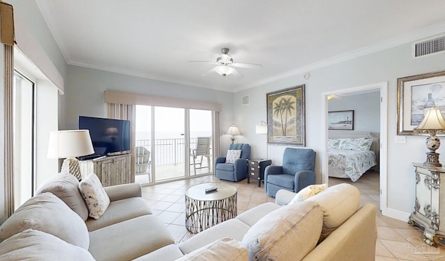 931 W Beach Blvd Unit 501, Gulf Shores, AL 36542 - living area with light tile patterned floors, ceiling fan, crown molding, and baseboards