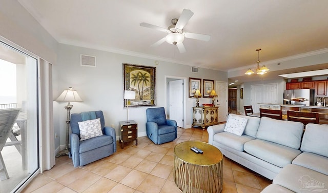 931 W Beach Blvd Unit 501, Gulf Shores, AL 36542 - living area featuring light tile patterned flooring, a ceiling fan, crown molding, a chandelier, and baseboards