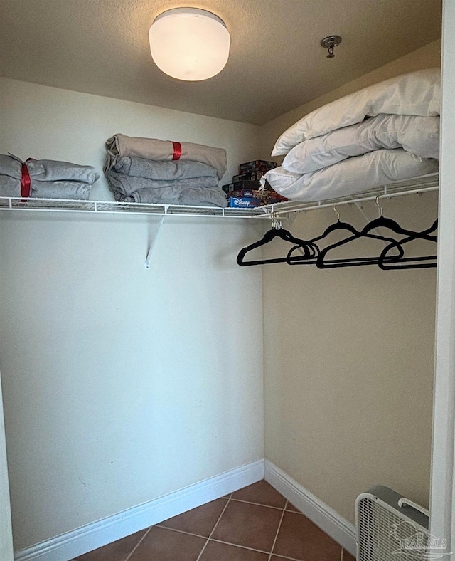 931 W Beach Blvd Unit 501, Gulf Shores, AL 36542 - walk in closet featuring dark tile patterned floors