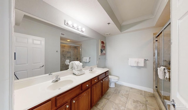 931 W Beach Blvd Unit 501, Gulf Shores, AL 36542 - full bathroom featuring a stall shower, double vanity, toilet, crown molding, and baseboards