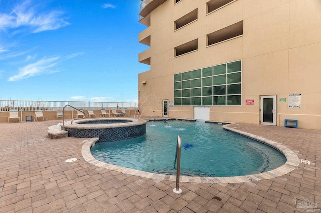 931 W Beach Blvd Unit 501, Gulf Shores, AL 36542 - view of pool with a pool with connected hot tub and a patio area