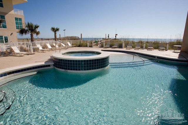 931 W Beach Blvd Unit 501, Gulf Shores, AL 36542 - view of pool featuring a patio, a pool with connected hot tub, and central AC unit