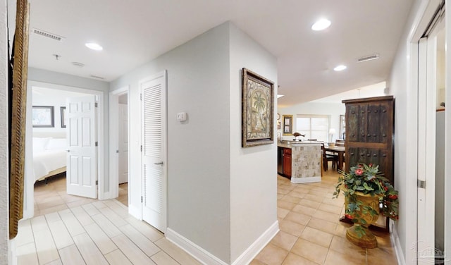 931 W Beach Blvd Unit 501, Gulf Shores, AL 36542 - corridor featuring recessed lighting, baseboards, and light tile patterned floors