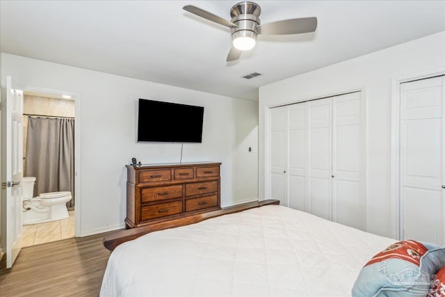 bedroom featuring ceiling fan, connected bathroom, and hardwood / wood-style floors