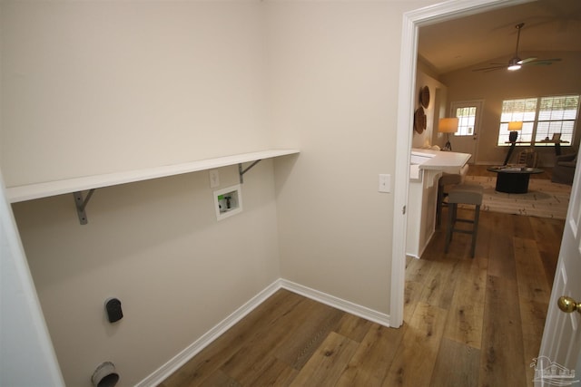 washroom featuring baseboards, a ceiling fan, laundry area, wood finished floors, and hookup for a washing machine