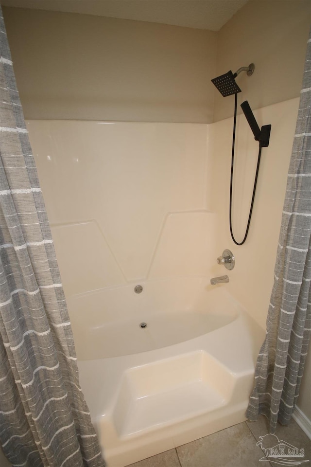 bathroom with tile patterned flooring and a shower with curtain