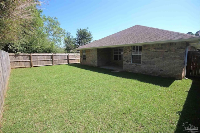 view of yard with a fenced backyard