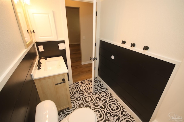 bathroom featuring toilet and vanity