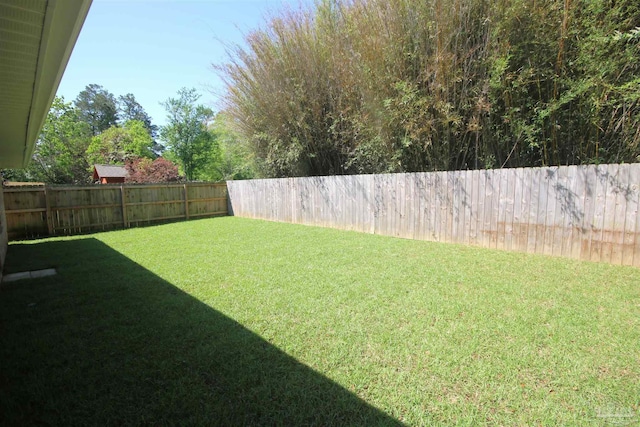 view of yard with a fenced backyard