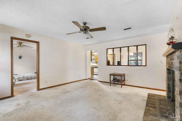 921 Candlestick Dr, Pensacola, FL 32514 - living area with a fireplace, ceiling fan, carpet flooring, a textured ceiling, and baseboards
