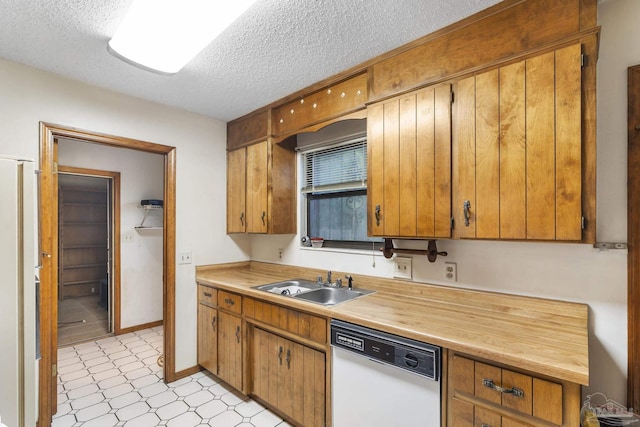 921 Candlestick Dr, Pensacola, FL 32514 - kitchen featuring white appliances, a sink, a textured ceiling, light countertops, and light floors