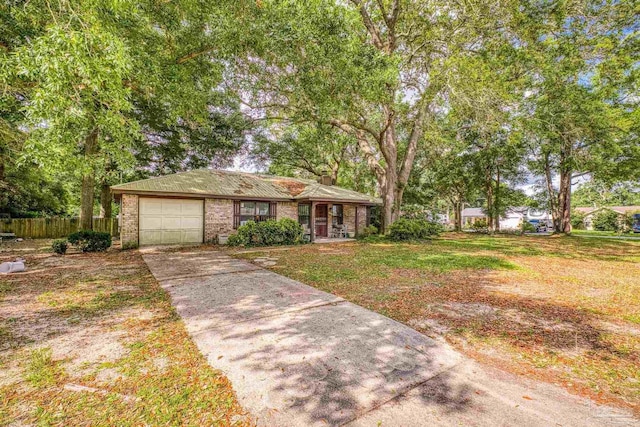 921 Candlestick Dr, Pensacola, FL 32514 - view of front of house featuring a garage, concrete driveway, brick siding, a chimney, and a porch