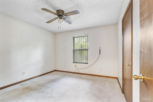 921 Candlestick Dr, Pensacola, FL 32514 - spare room featuring light carpet, a textured ceiling, a ceiling fan, and baseboards