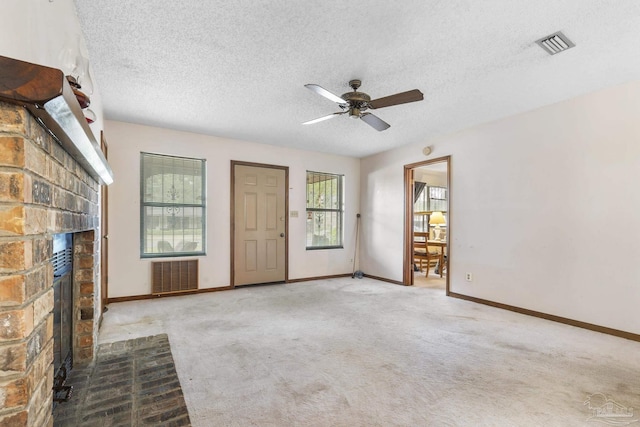 921 Candlestick Dr, Pensacola, FL 32514 - unfurnished living room with a brick fireplace, ceiling fan, carpet, baseboards, and a textured ceiling