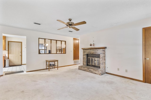 921 Candlestick Dr, Pensacola, FL 32514 - unfurnished living room featuring a ceiling fan, baseboards, a brick fireplace, and carpet floors