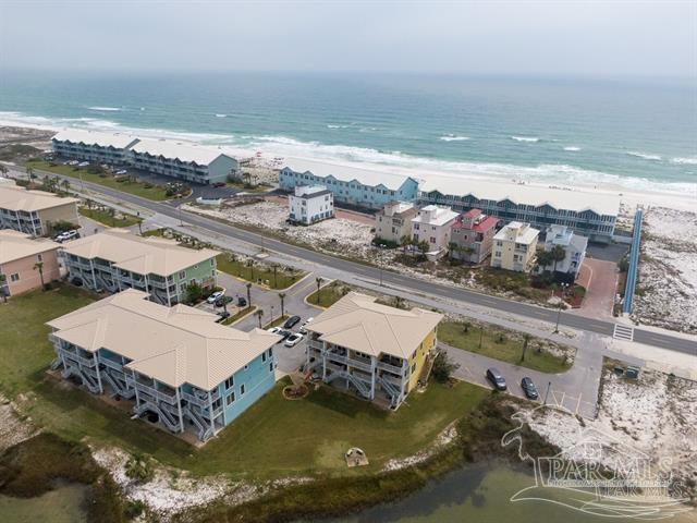 bird's eye view with a beach view and a water view