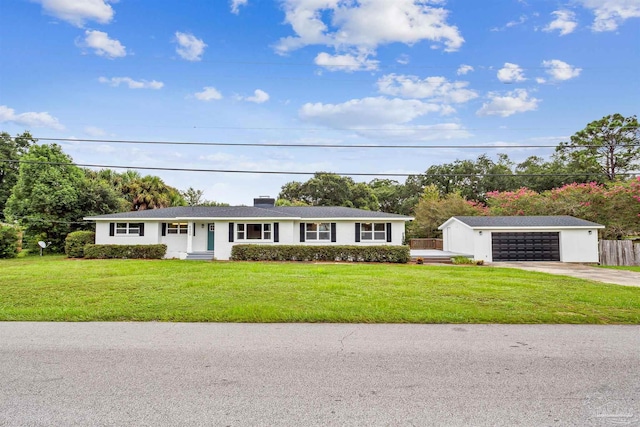 ranch-style home featuring a front lawn and a garage