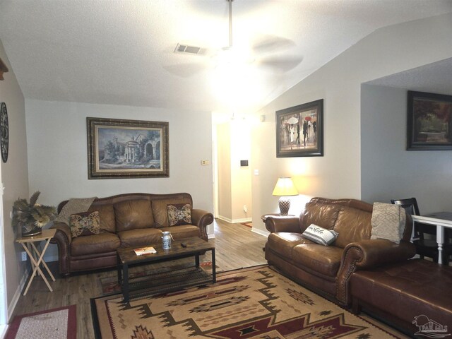 5358 Jenny Cir, Pace, FL 32571 - living area featuring a ceiling fan, wood finished floors, and vaulted ceiling