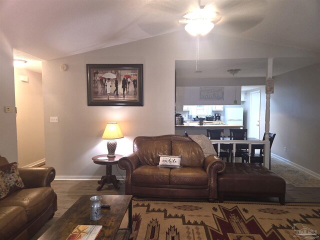 5358 Jenny Cir, Pace, FL 32571 - living area featuring vaulted ceiling, ceiling fan, and wood finished floors